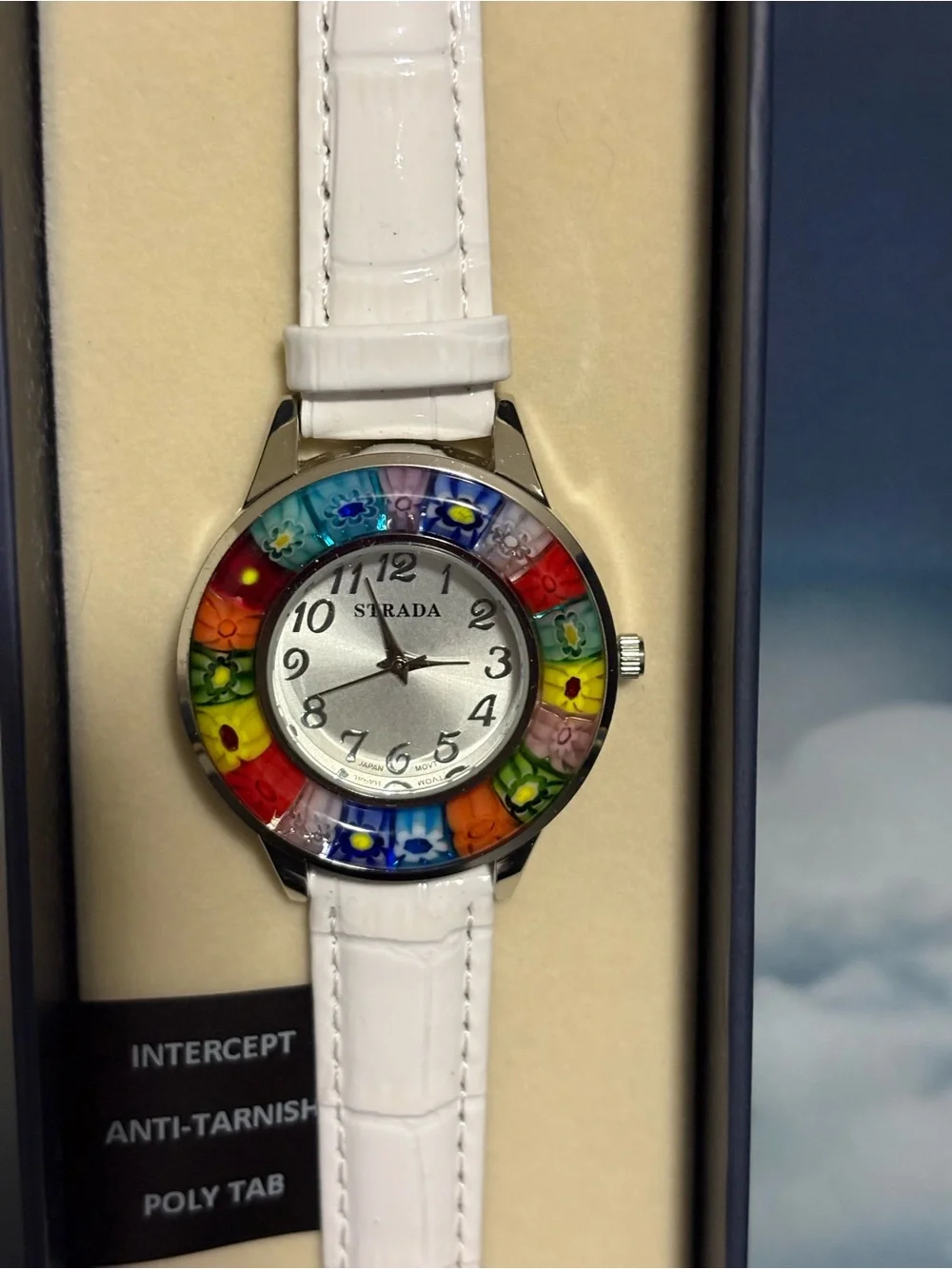 Strada watch multicolored floral millefiori bezel white band. New in box.